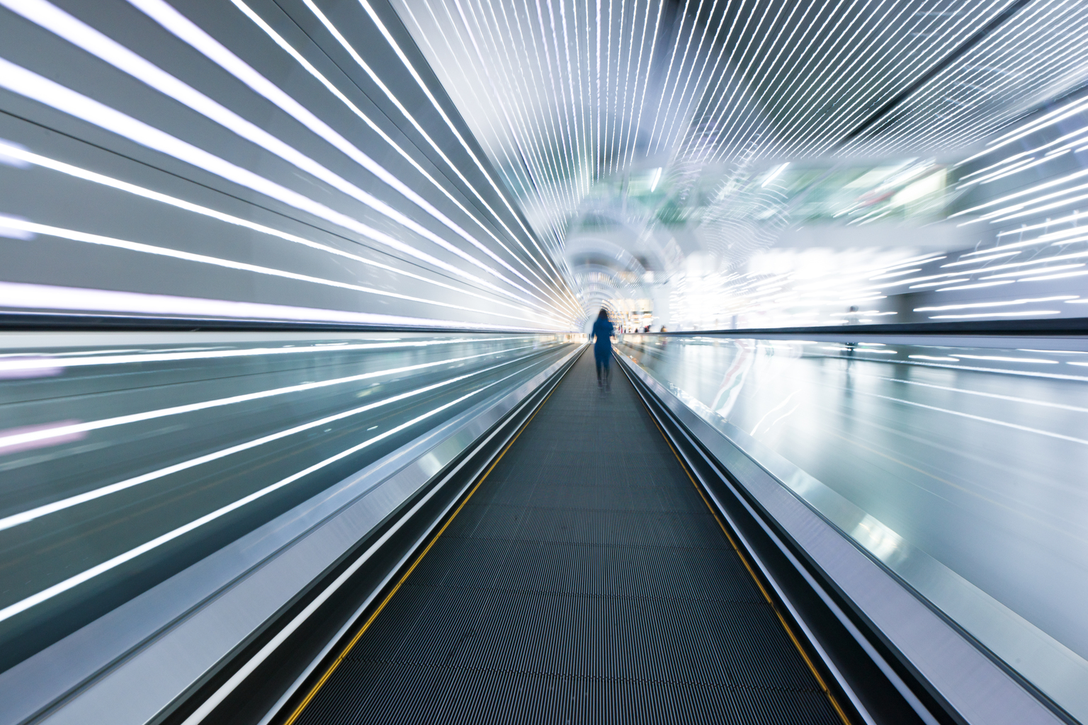 Long horizontal escalator at international airport terminal