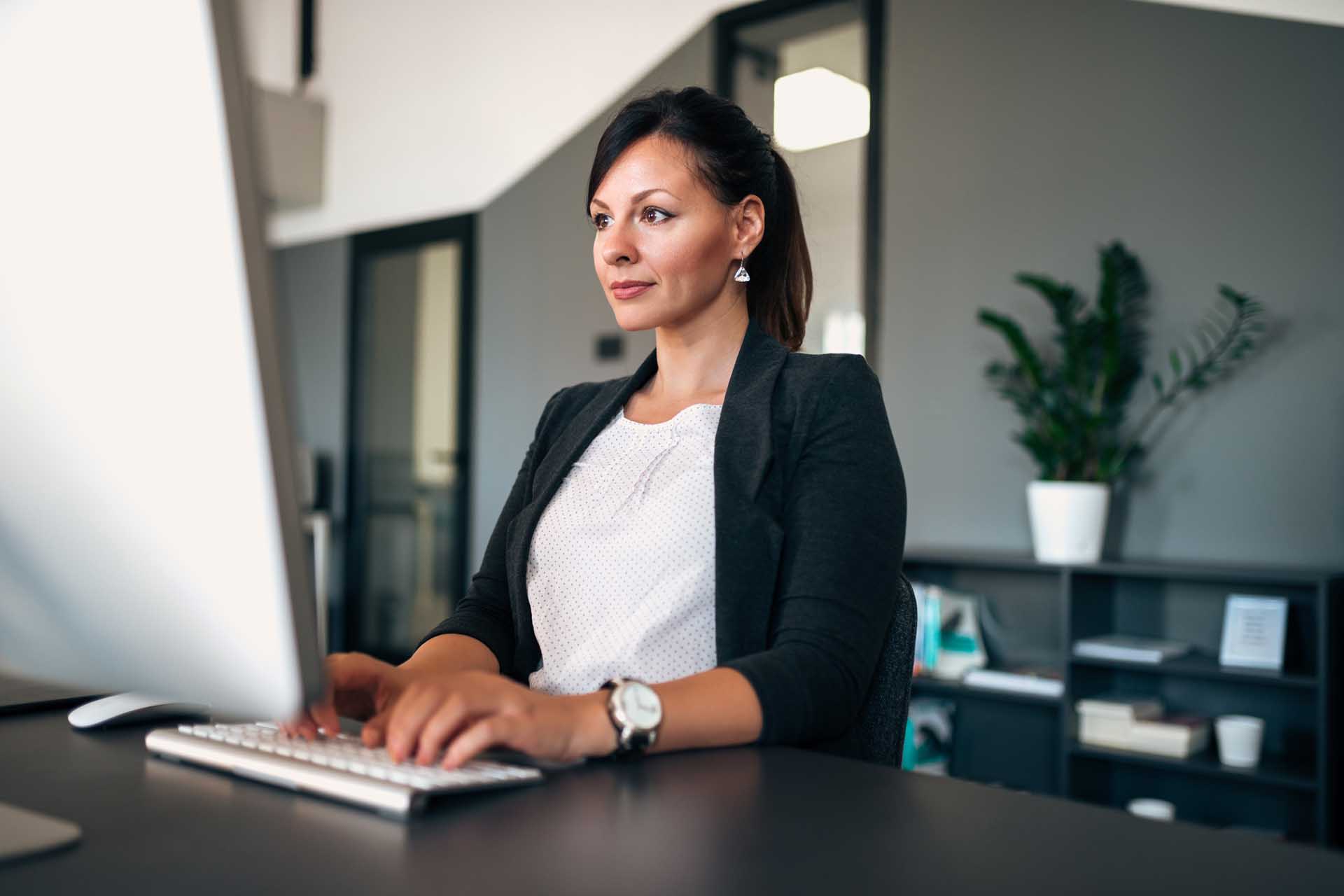 woman managing liens and filings on a computer