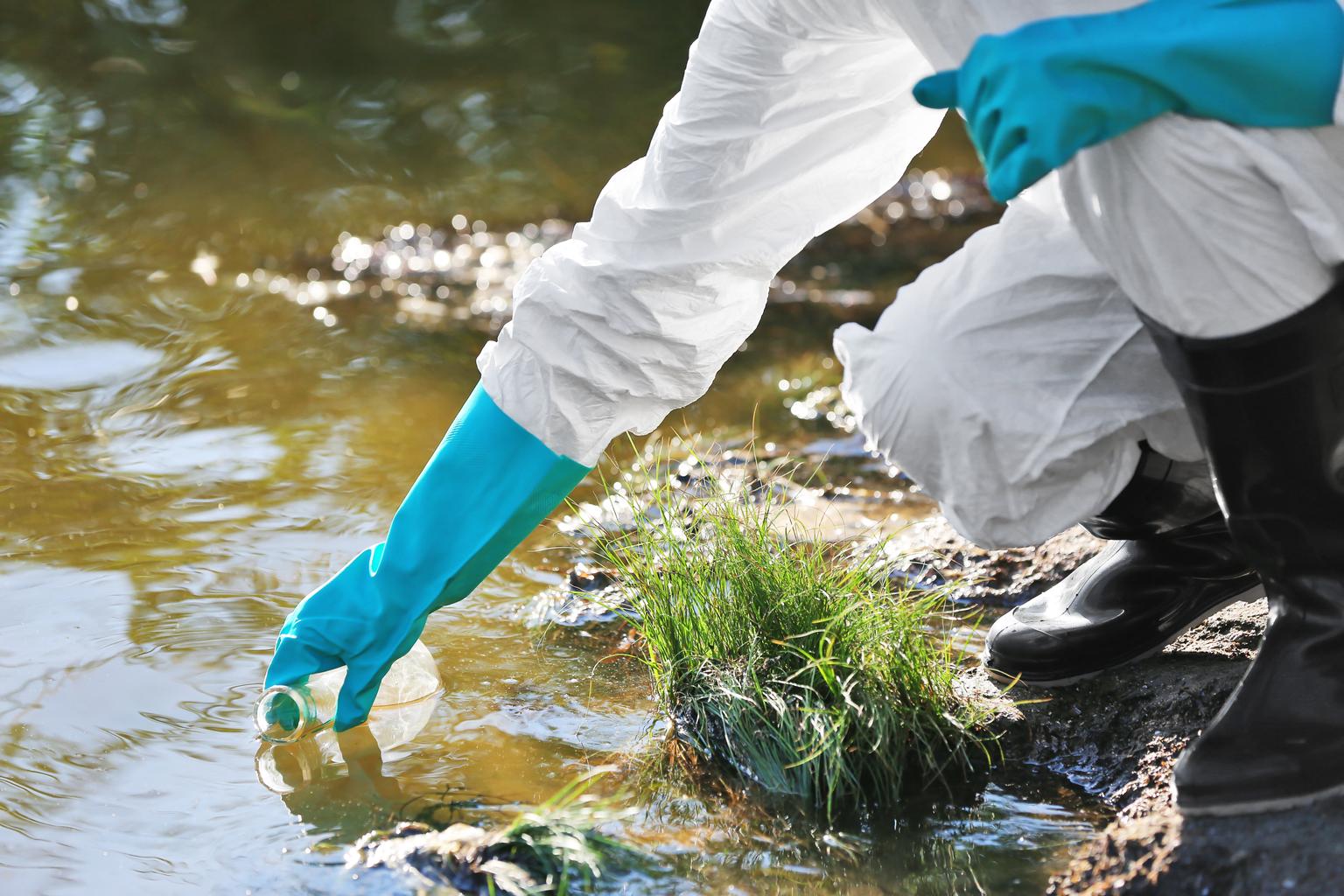 Woman with flask for expertise. Environmental pollution concept