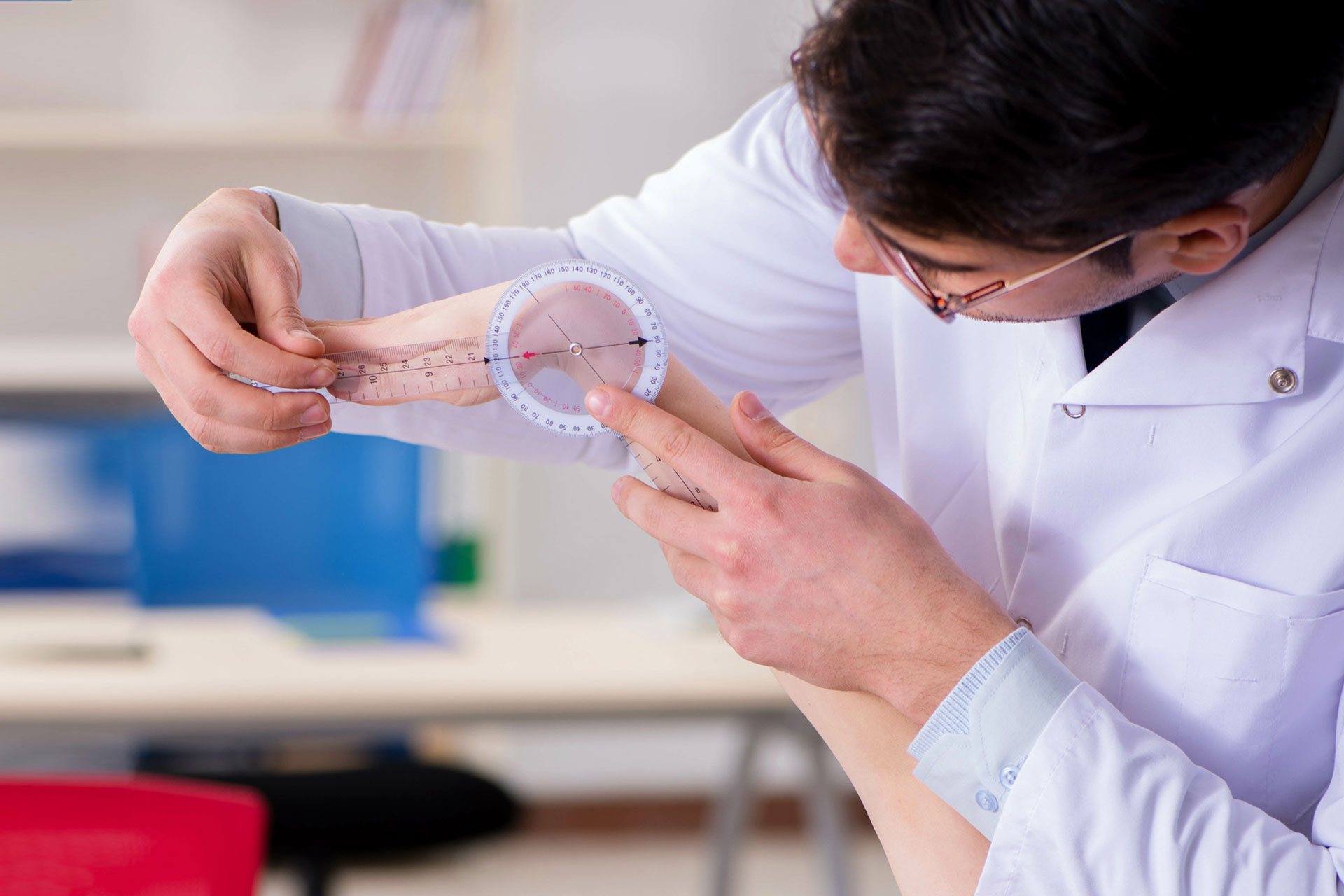 Doctor examining a patient's wrist