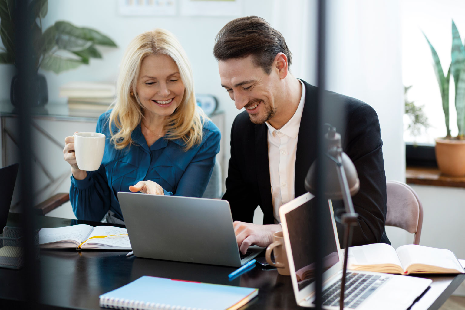 two people looking at a laptop 2