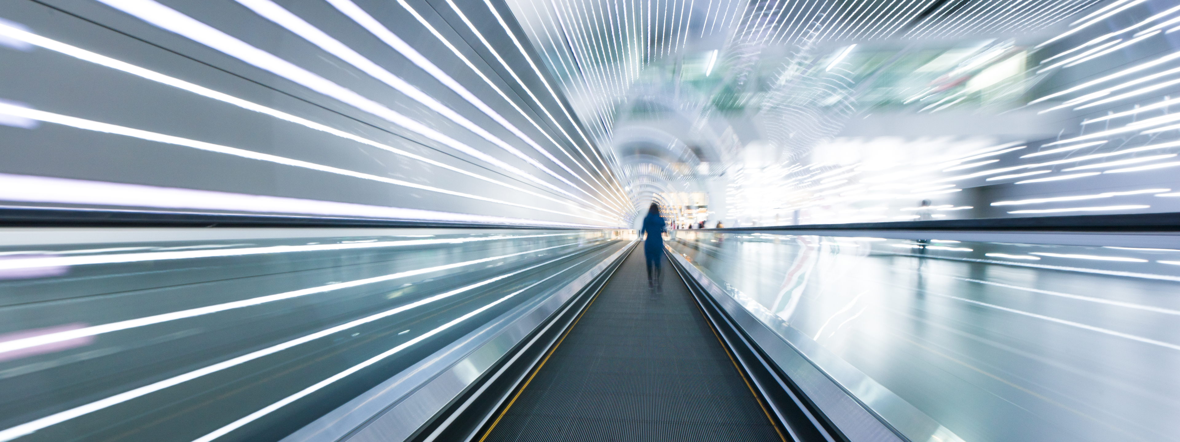 Long horizontal escalator at international airport terminal