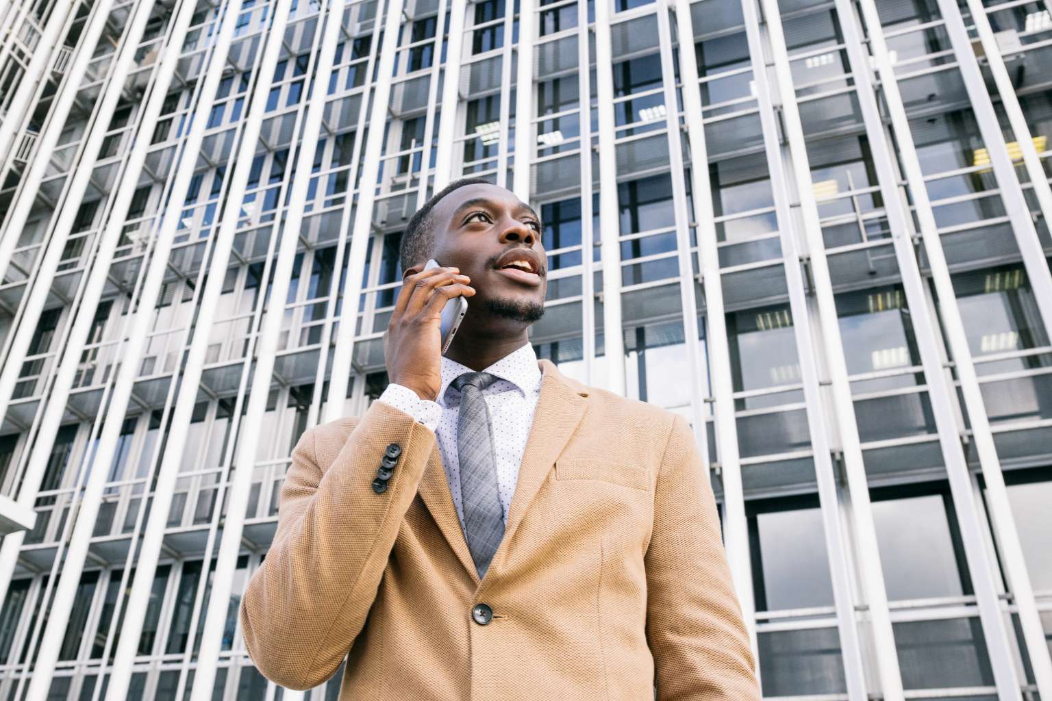 Man on phone outside building