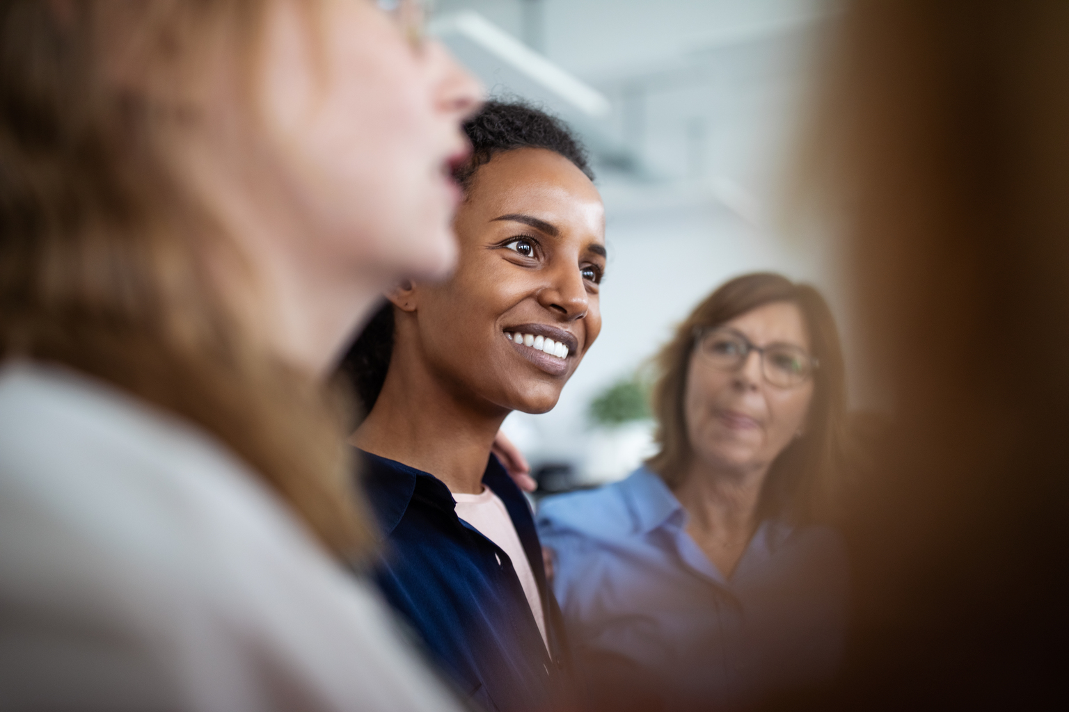 Women of multi-ethnic background meeting and discussing.