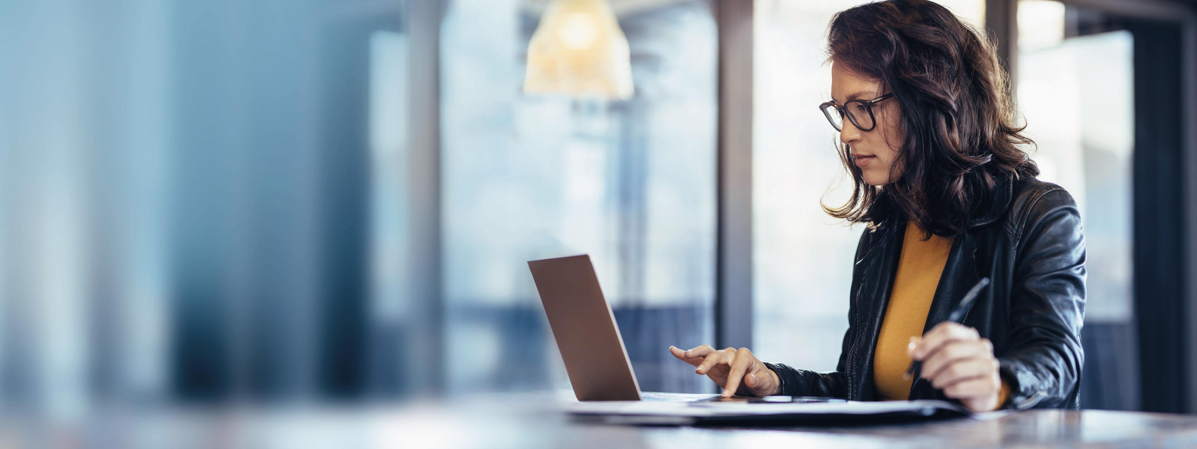 Wolters Kluwer woman working computer