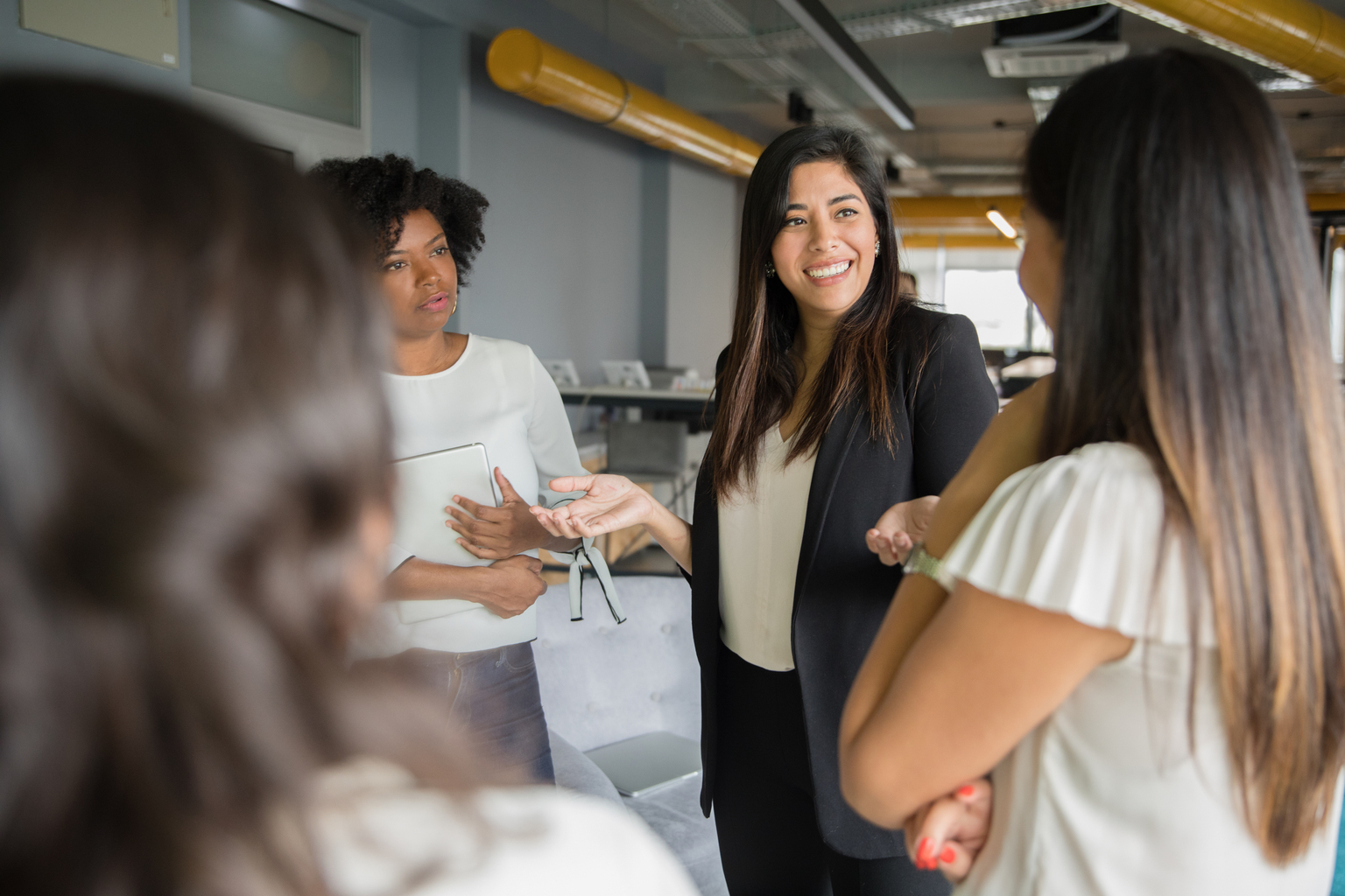 Group of women having informal conversation