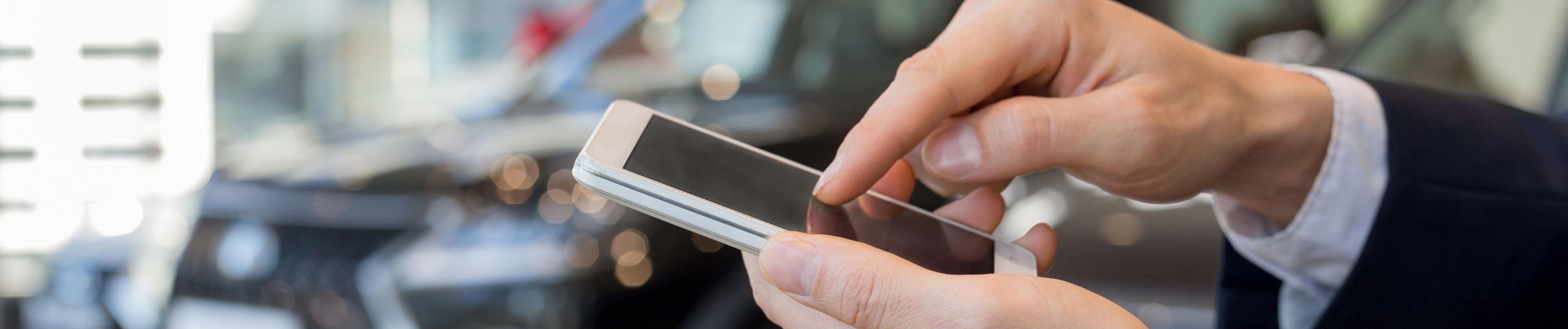 car dealer on mobile phone