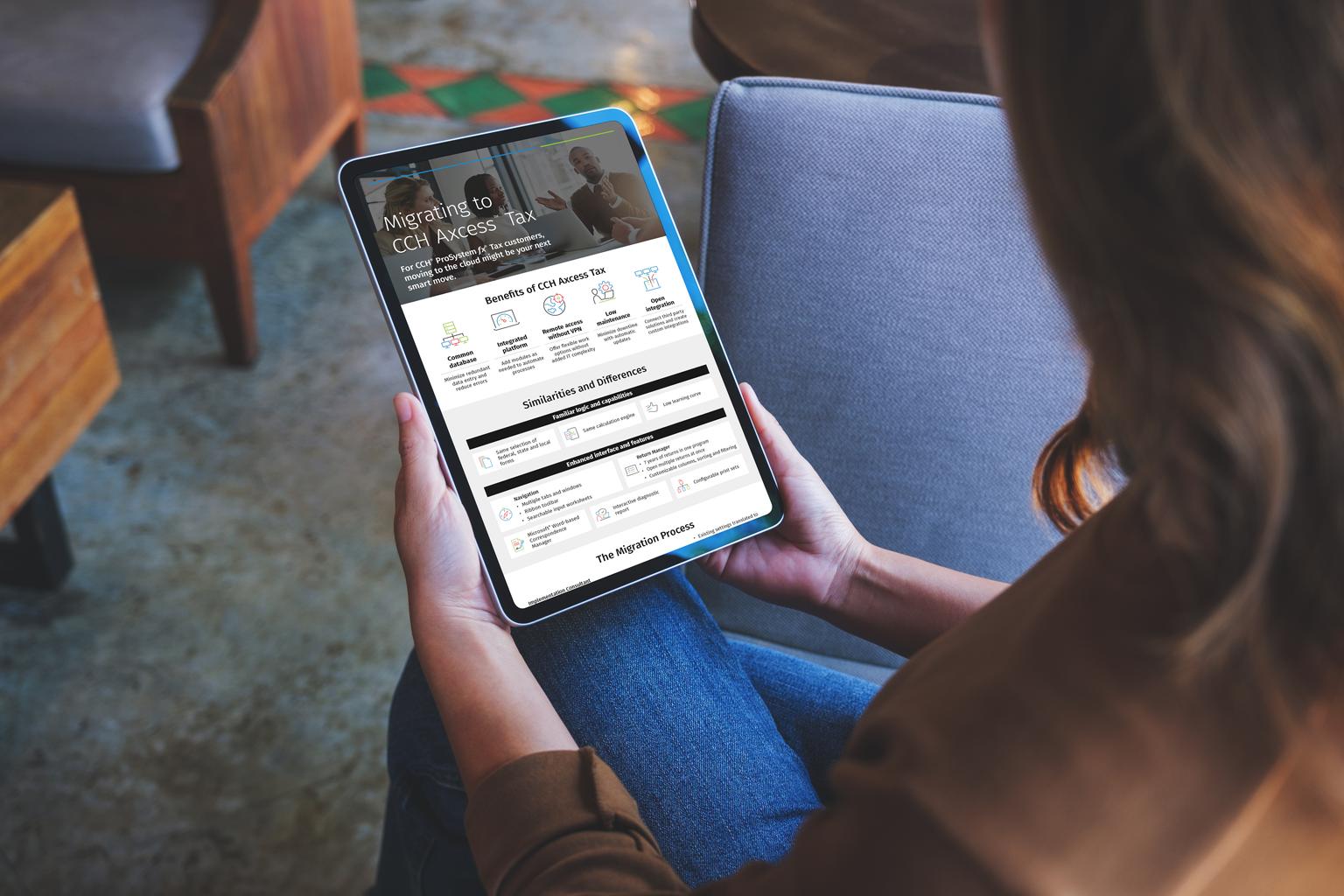 Over the shoulder shot of a person viewing the CCH Axcess Tax Migration infographic on a tablet.