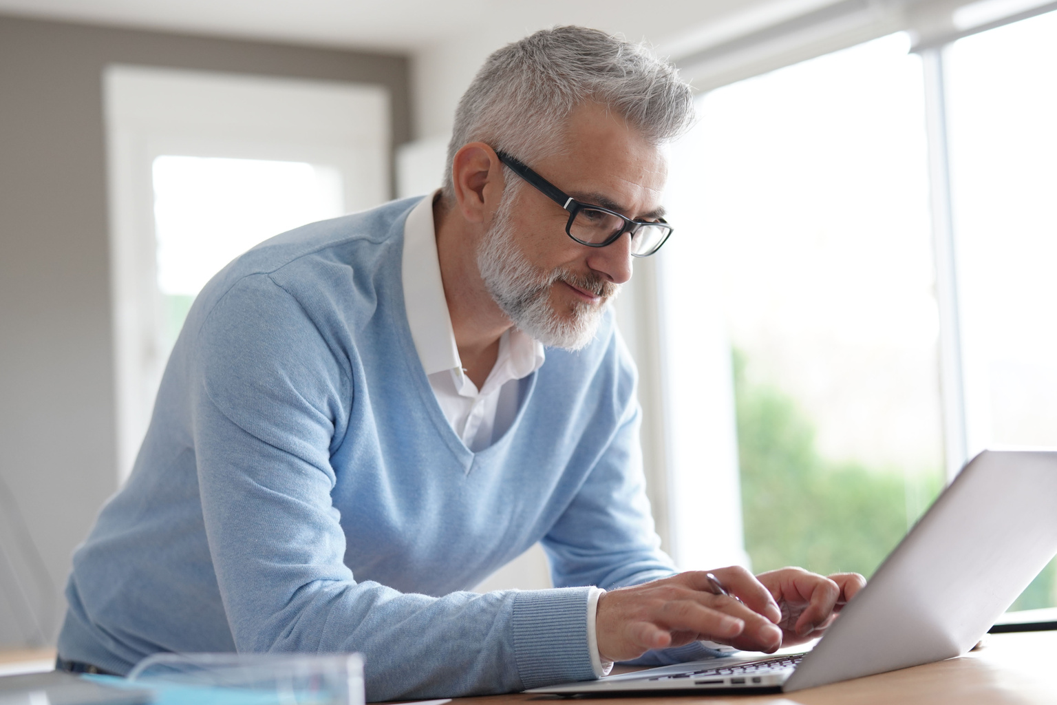 Mature man working on his laptop