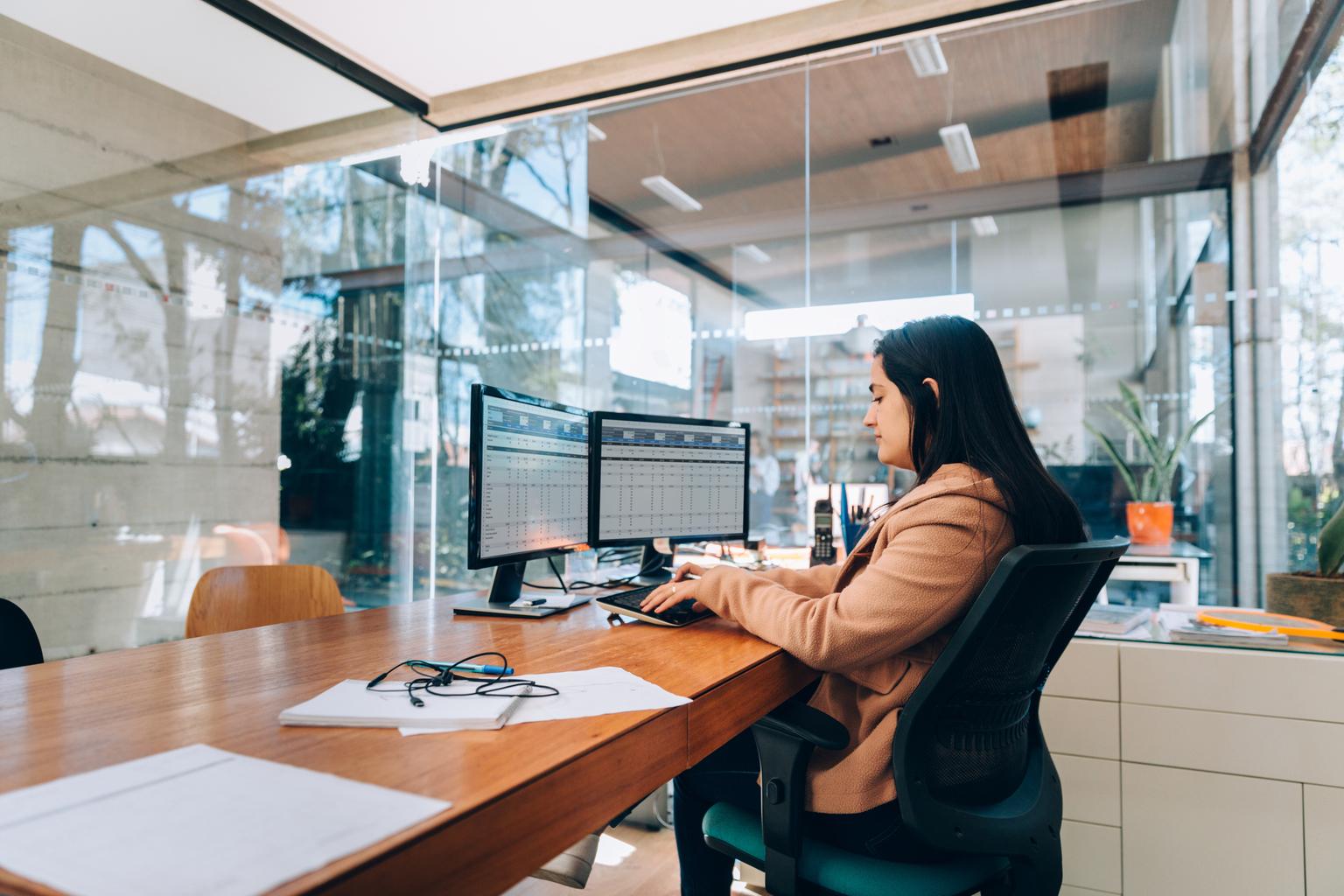 Woman works on laptop