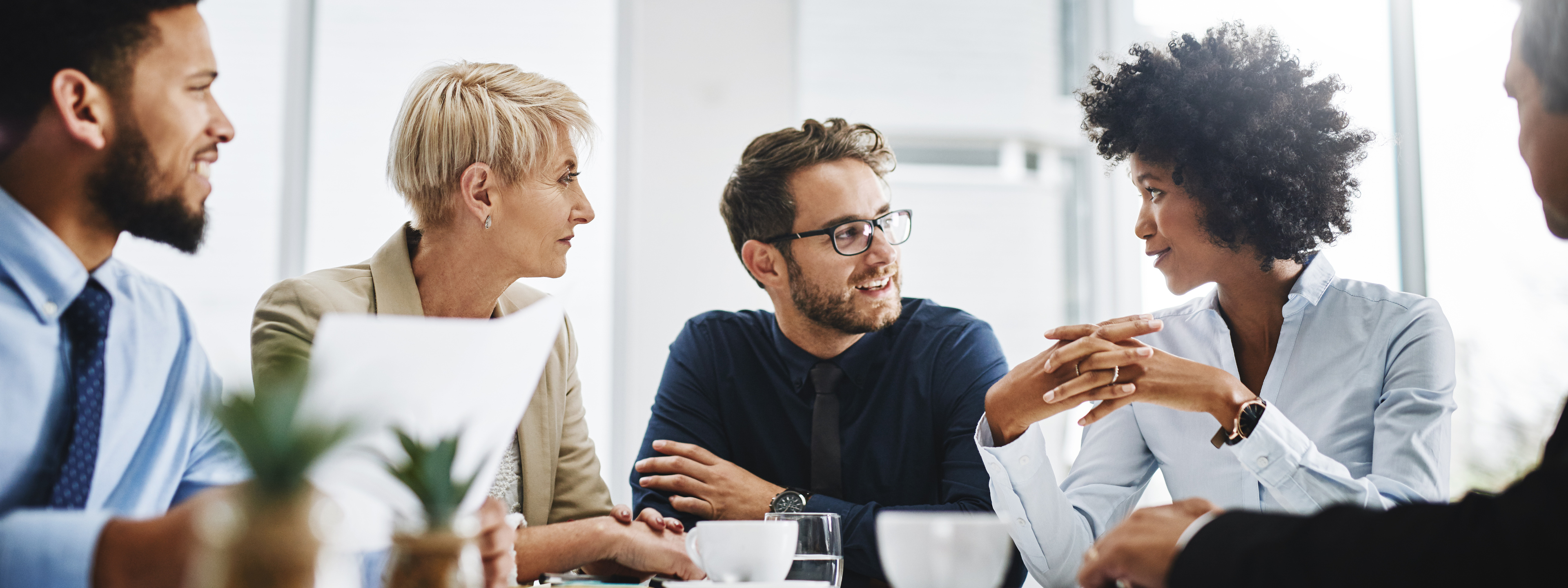 Diverse Employees Team Discussing Project At Briefing In Boardroom