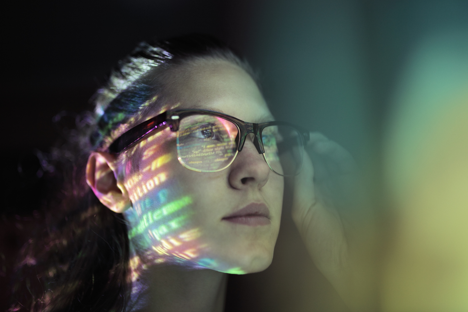 woman with brown glasses staring at code screen with the reflection hitting her glasses, Q3 2021, TAA NA US - Preparer