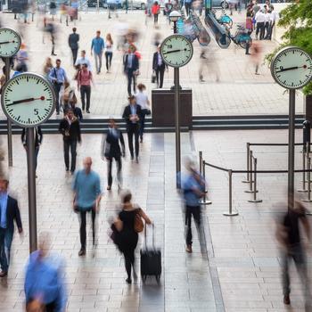 Clocks and commuters, Canary Wharf, London.