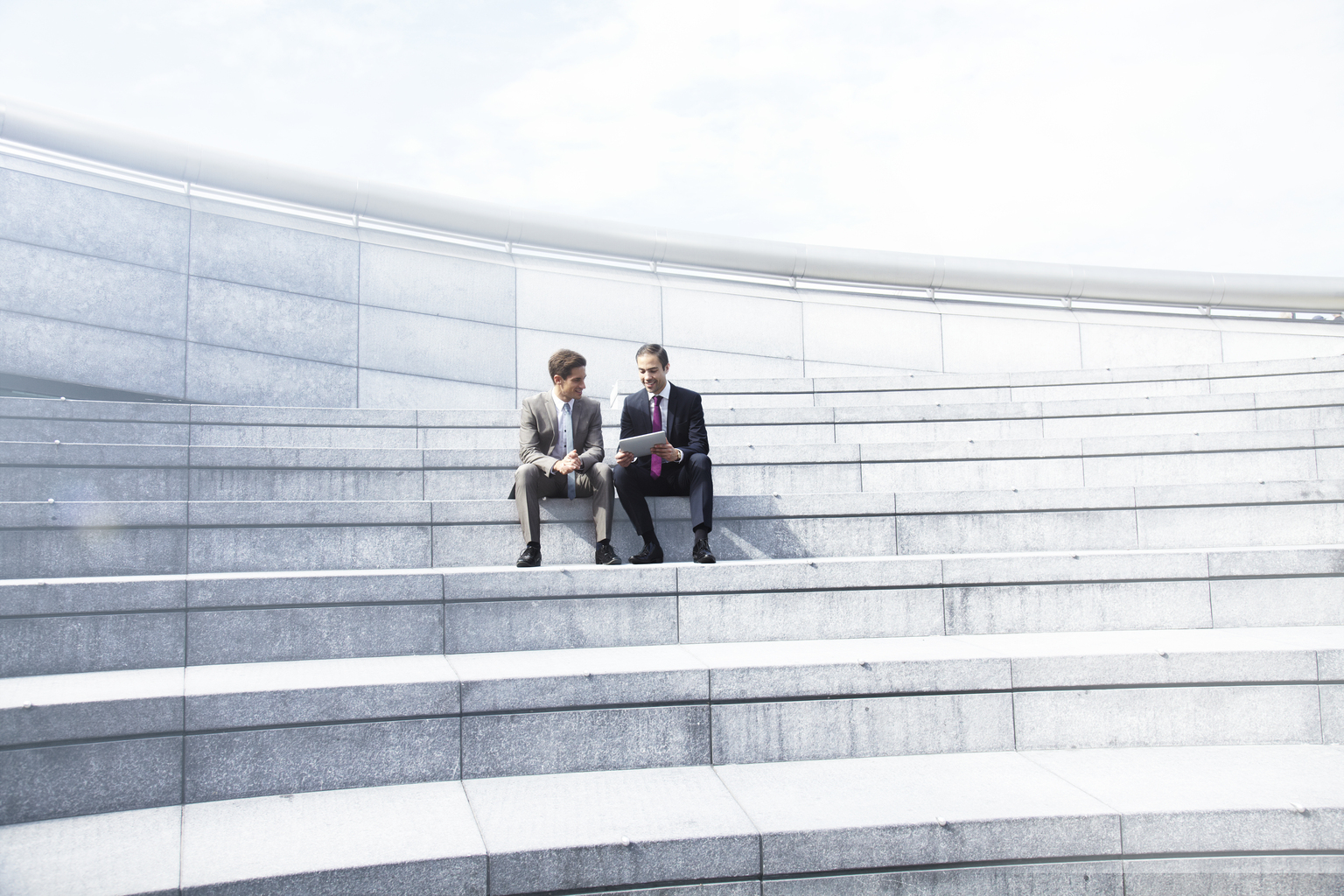 Two businessmen working in a tablet. 