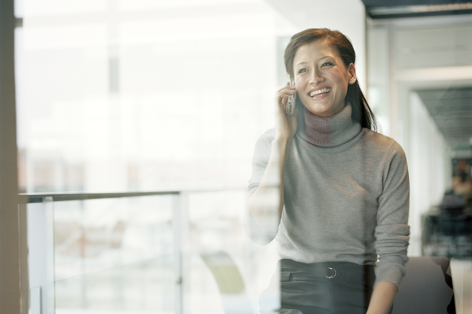 Businesswoman using mobile phone in office 