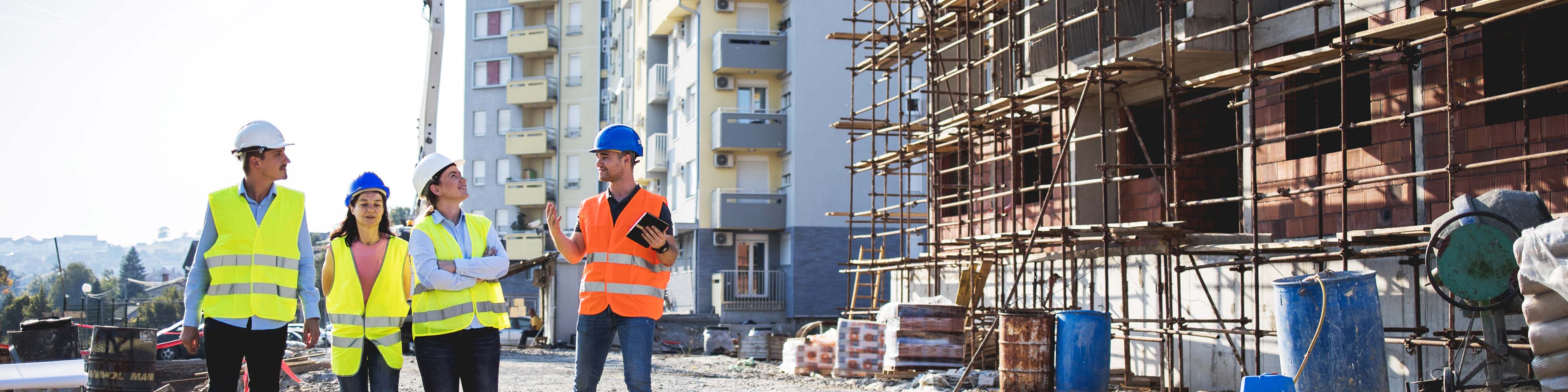 construction co-workers discussing how to start a construction business