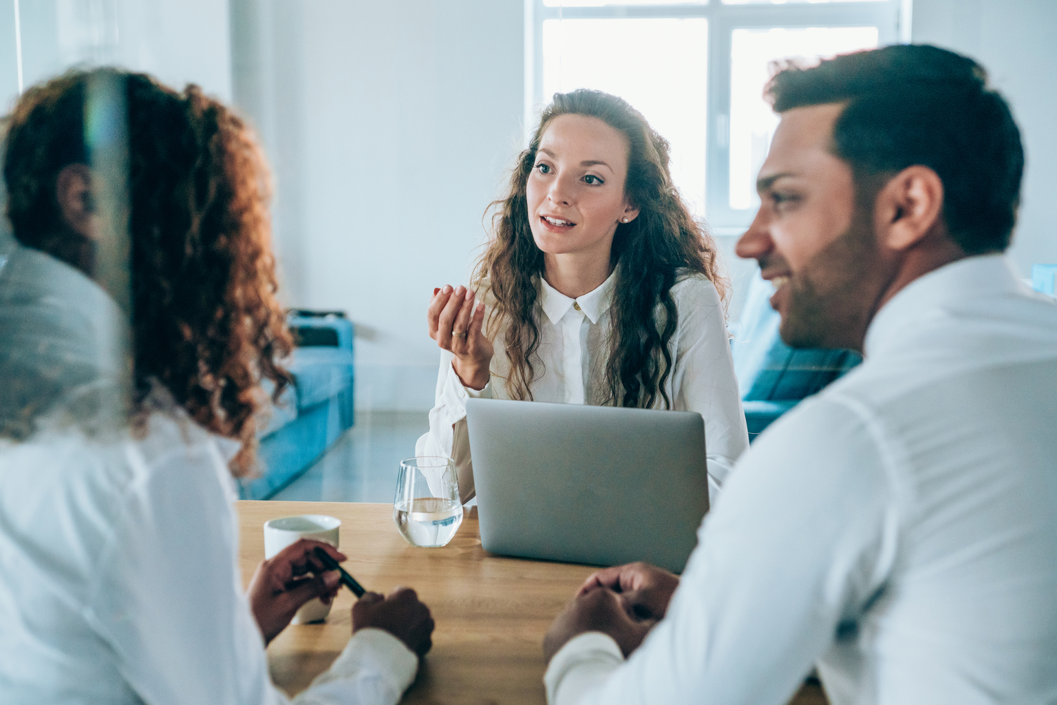 Woman Talking with Colleagues