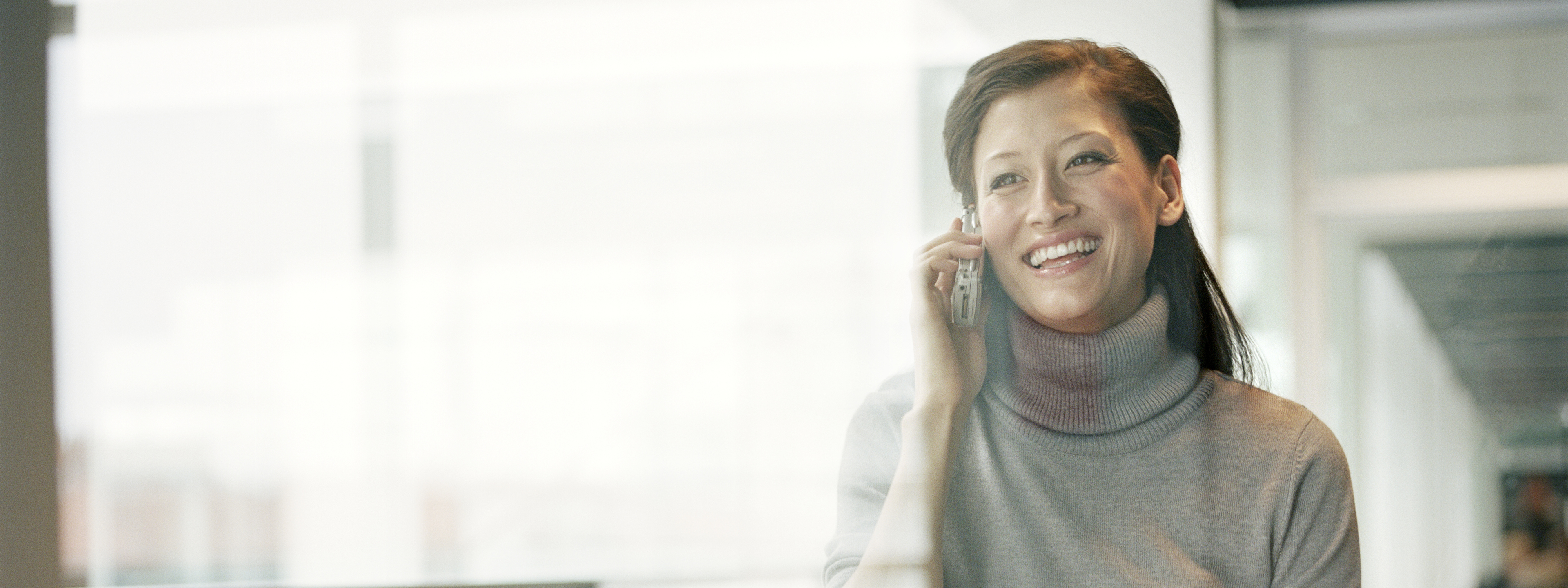 Businesswoman using mobile phone in office 