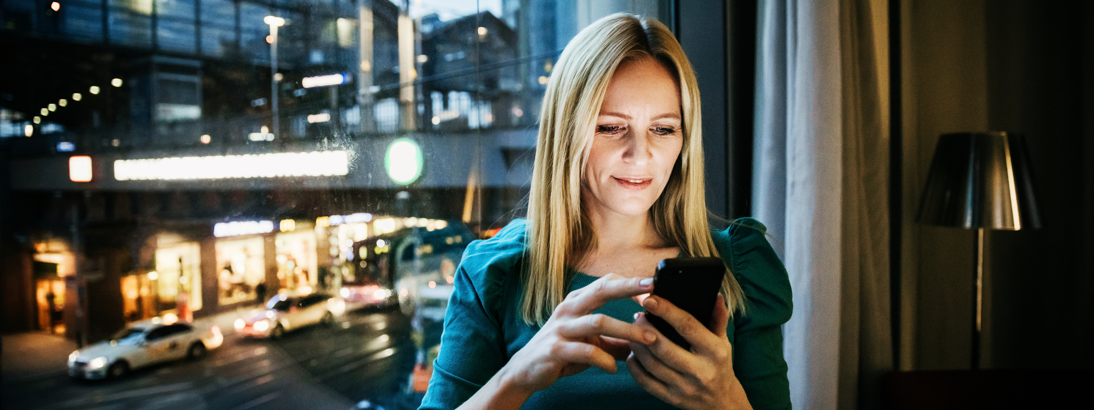 Businesswoman Networking Using Her Smartphone