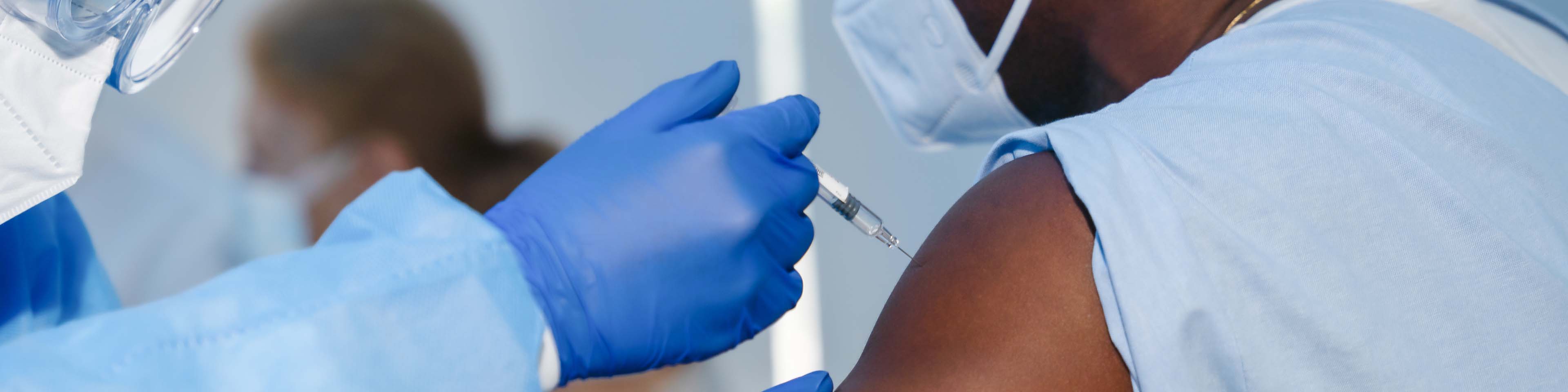 African-American male receiving Covid vaccine