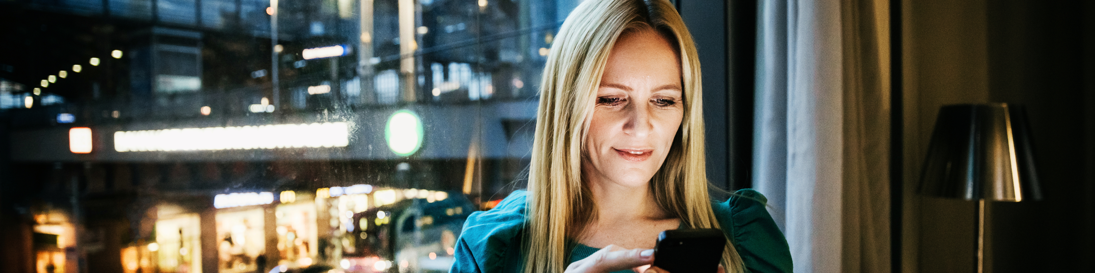 Businesswoman Networking Using Her Smartphone