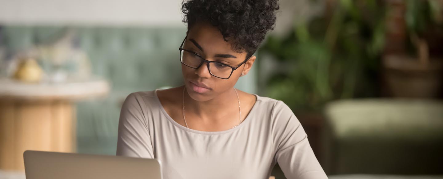 Woman studying a computer