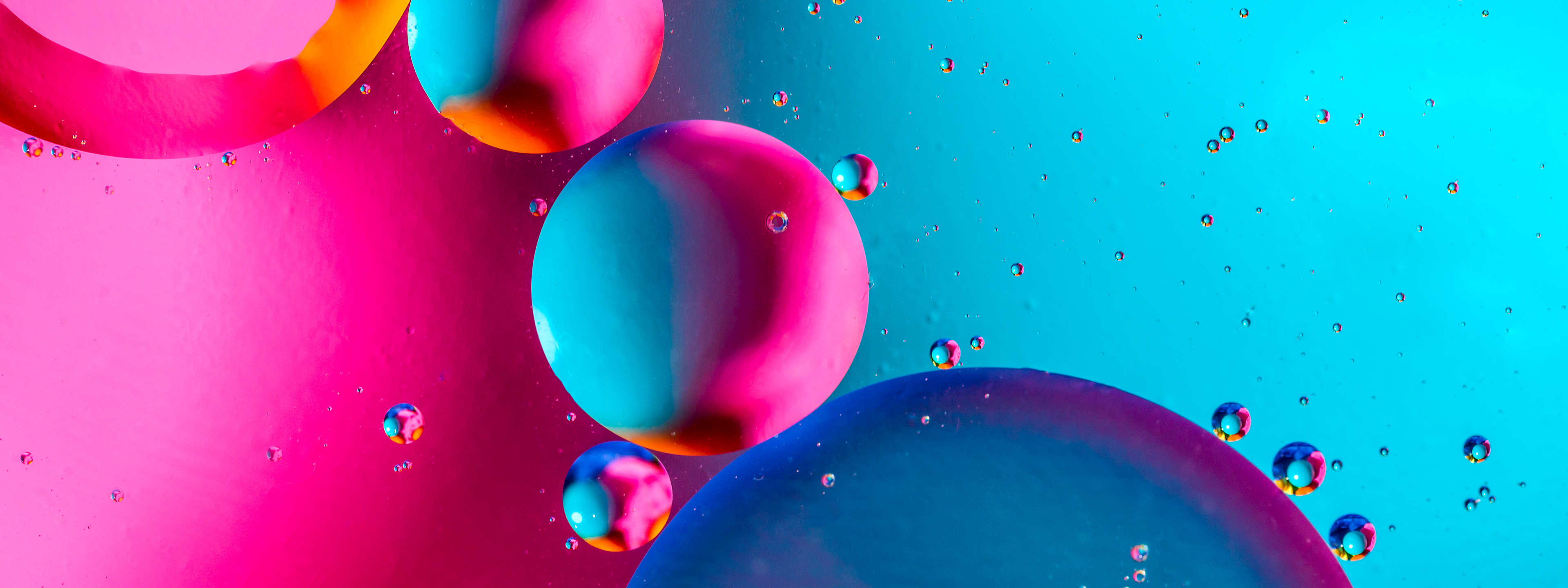 Abstract background with colorful pink blue gradient colors. Oil drops in water abstract psychedelic pattern image