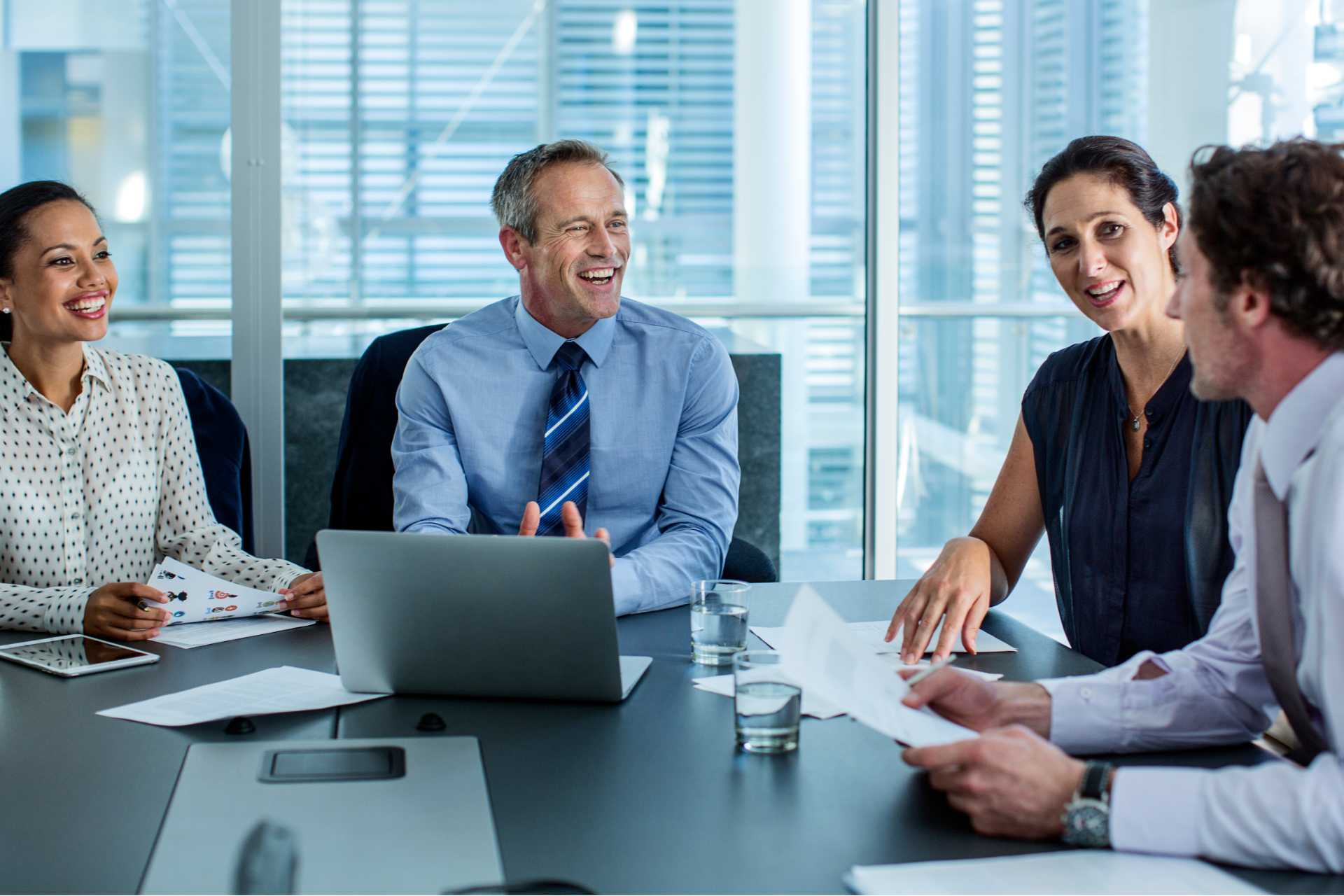 Group of professionals meet at office table