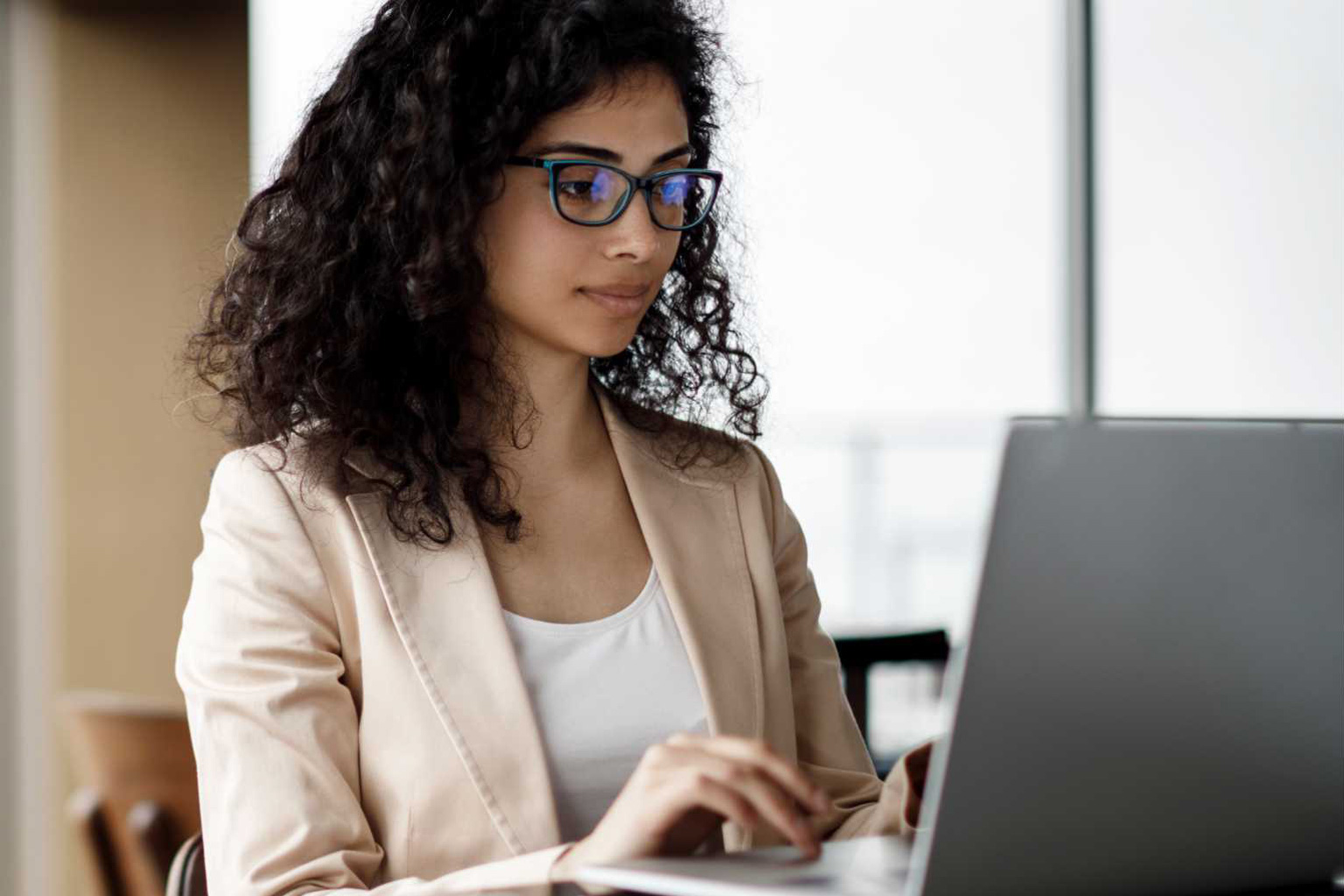 Woman works on laptop