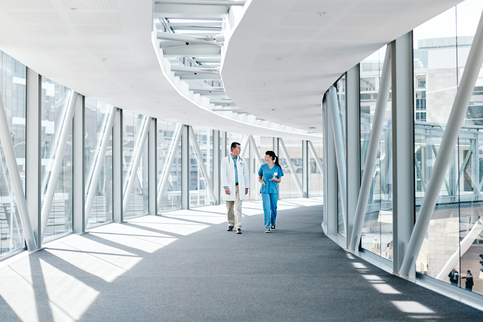 Shot of two healthcare workers walking together