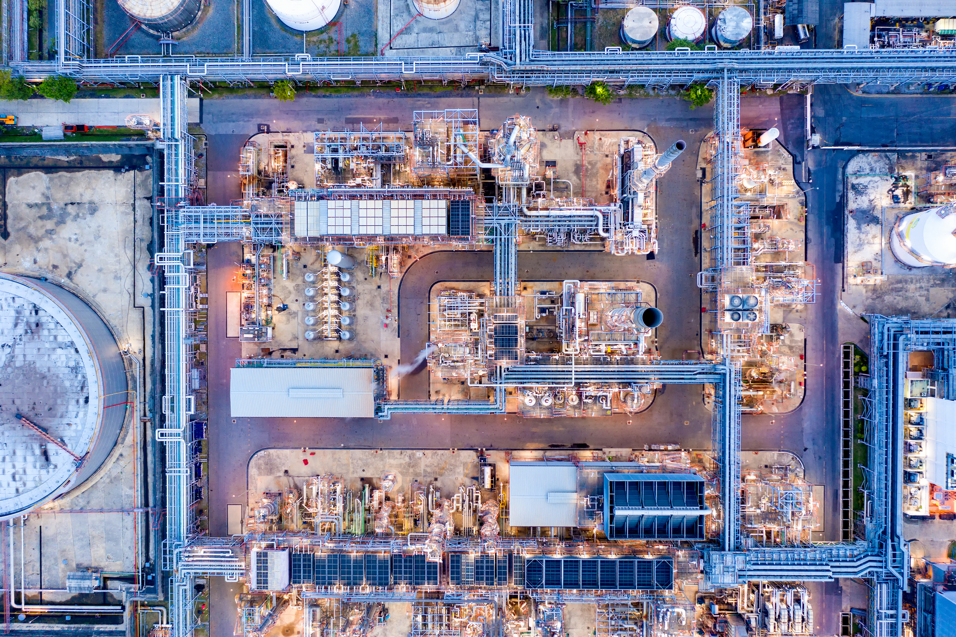 Aerial view of twilight of oil refinery ,Shot from drone of Oil refinery plant ,refinery Petrochemical plant at dusk , Bangkok, Thailand.