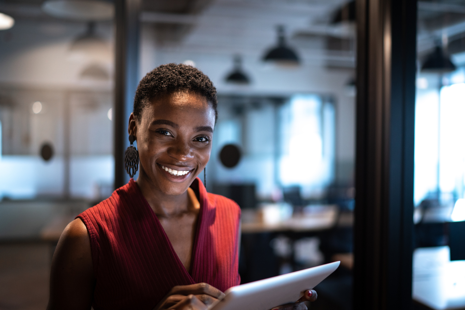 Portrait of businesswoman using digital tablet at office