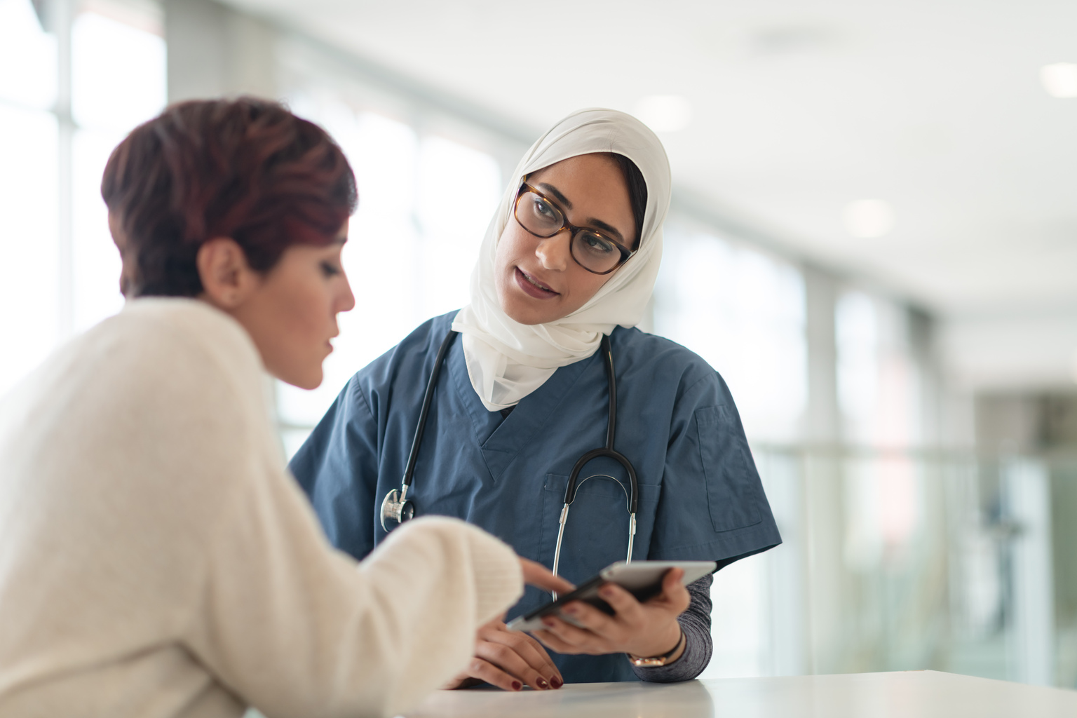 Muslim surgeon consults female patient.