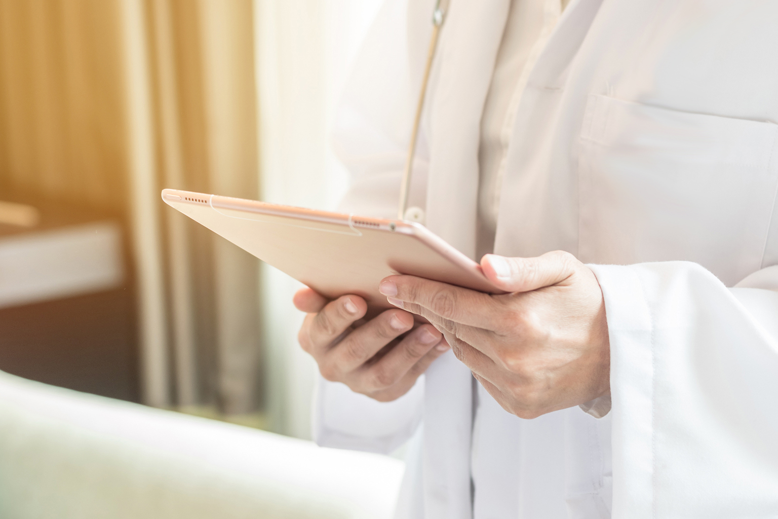 Healthcare professional holding a tablet