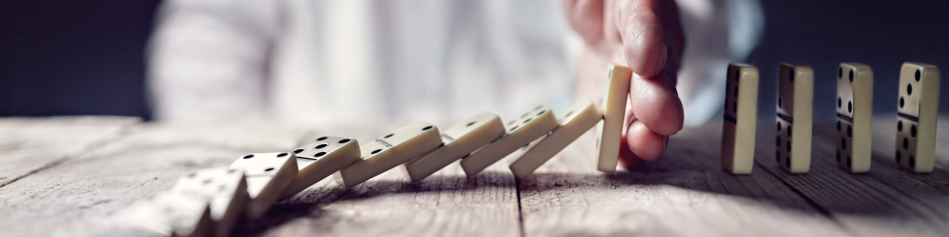 Image of a man with dominos 