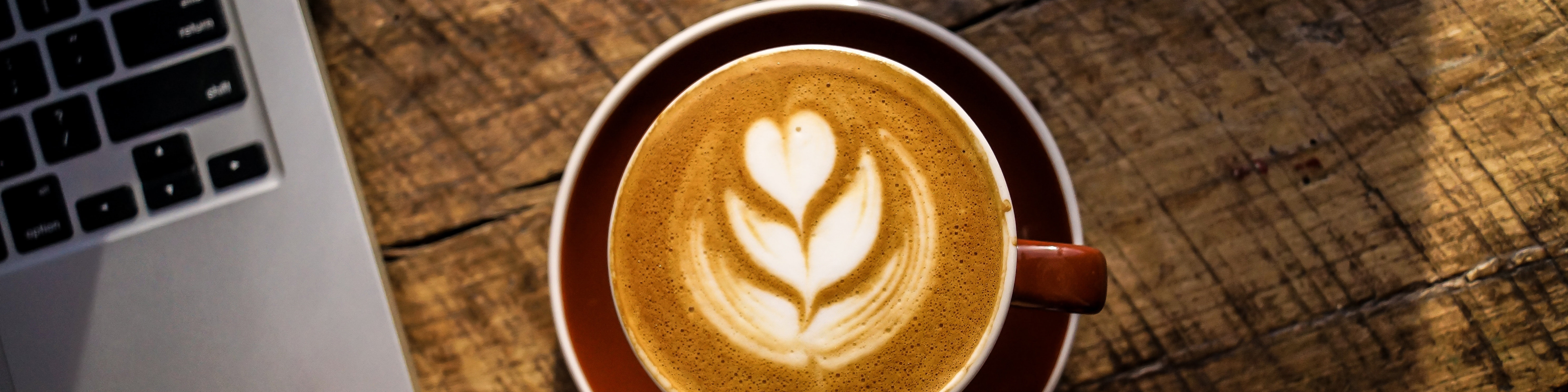 Birdseye view of a latte with heart art drawn on top