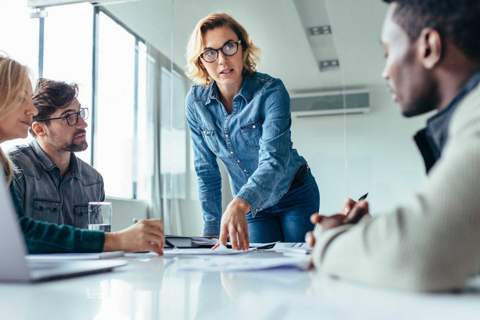 Woman leading team at table