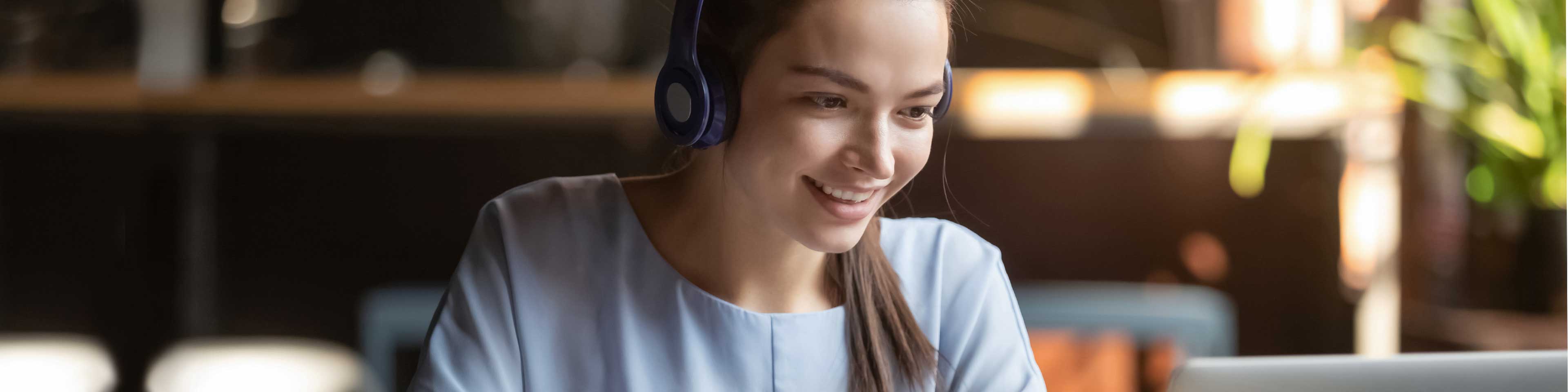 brunette with headset on smiling