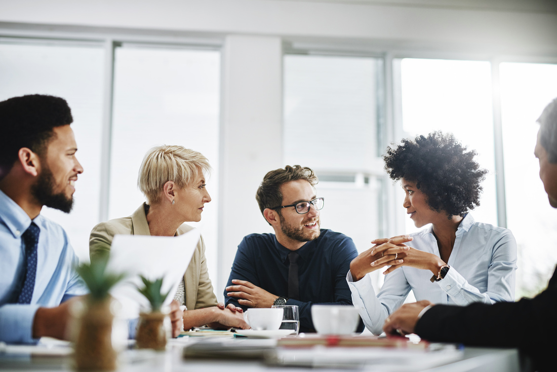 Diverse Employees Team Discussing Project At Briefing In Boardroom