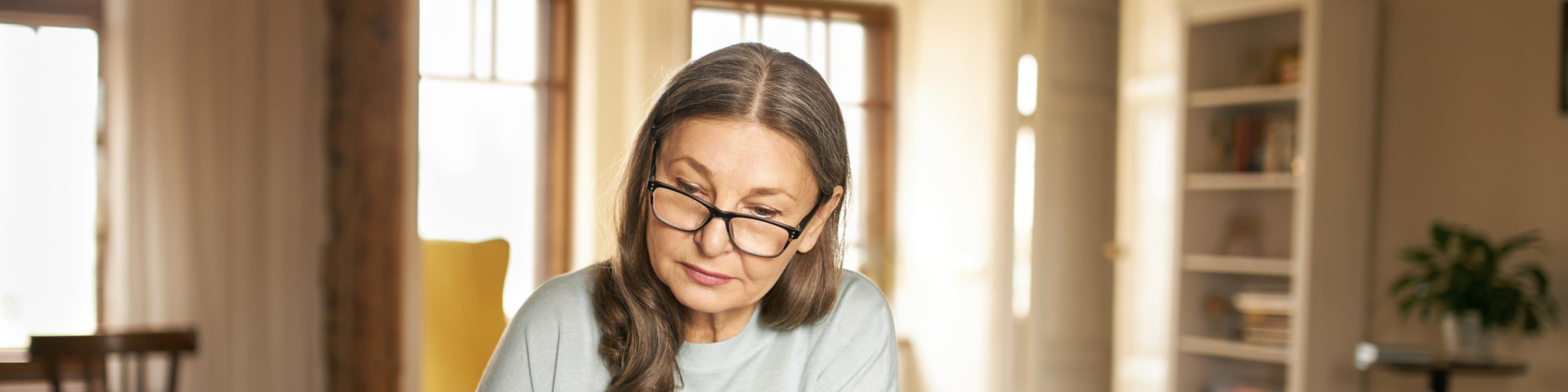 older woman reviewing trust