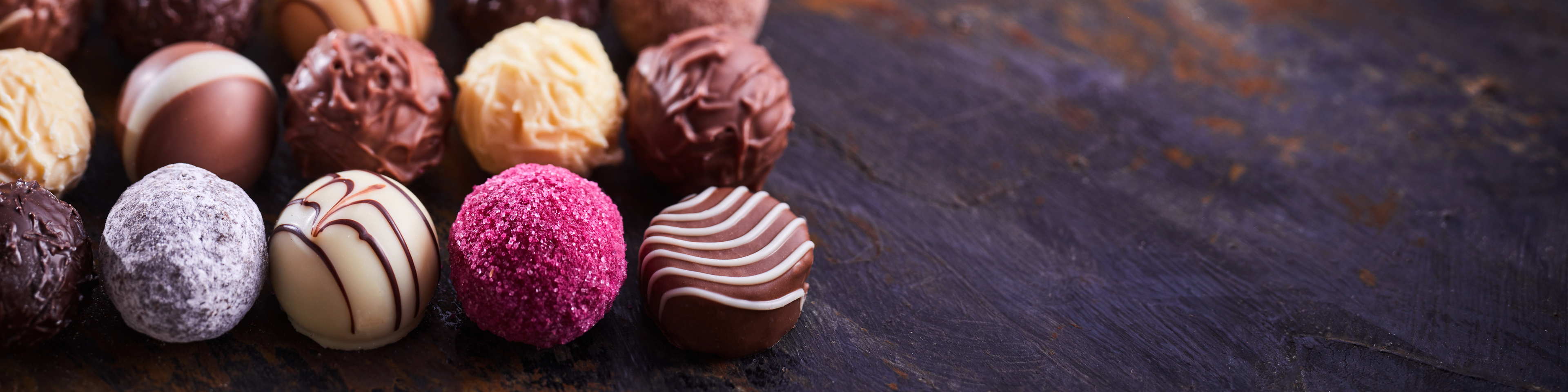 Luxury chocolate pralines arranged on table