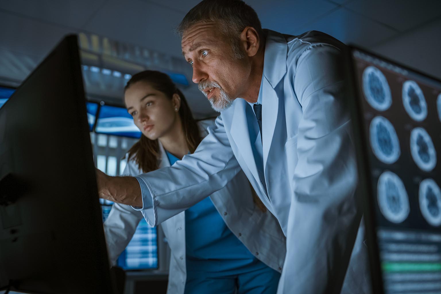 neurologists looking at computer