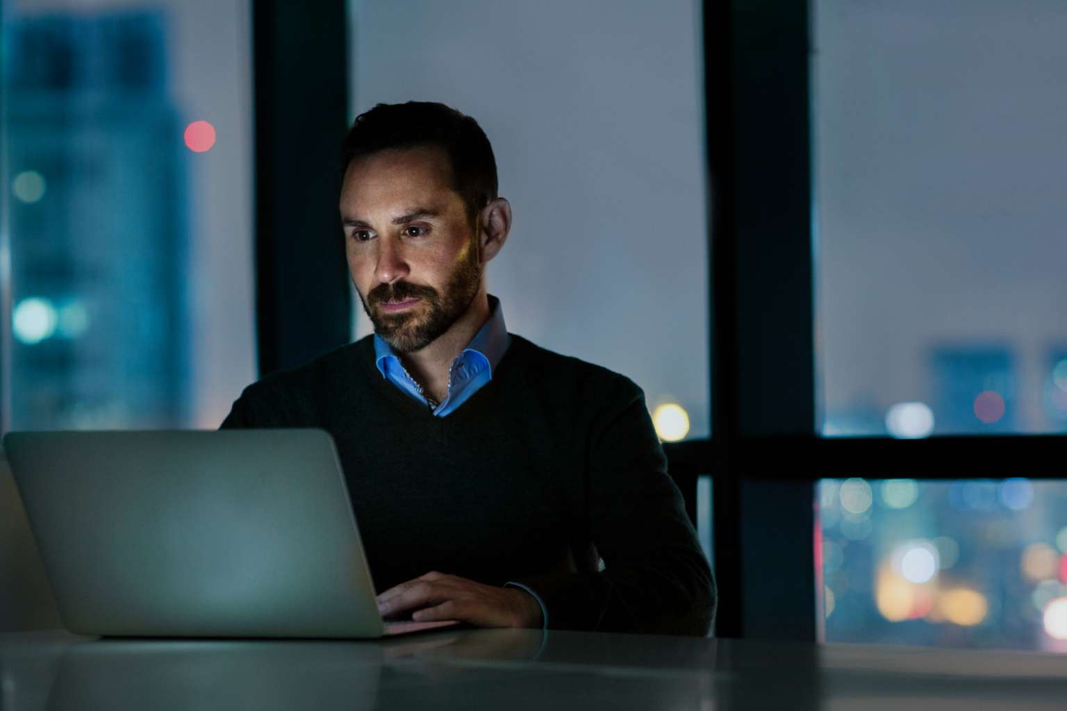 Man in office on laptop