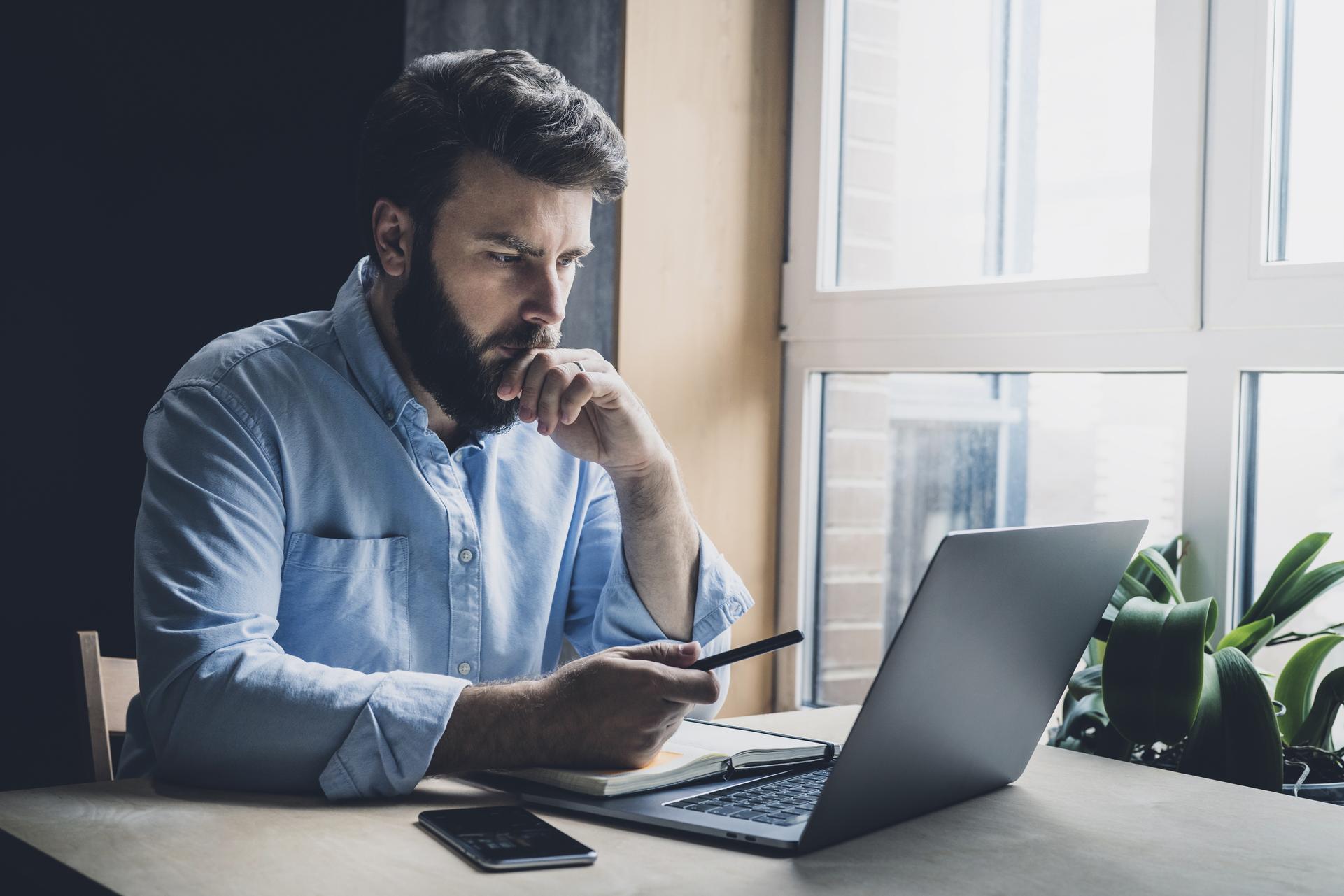 Man studying a computer