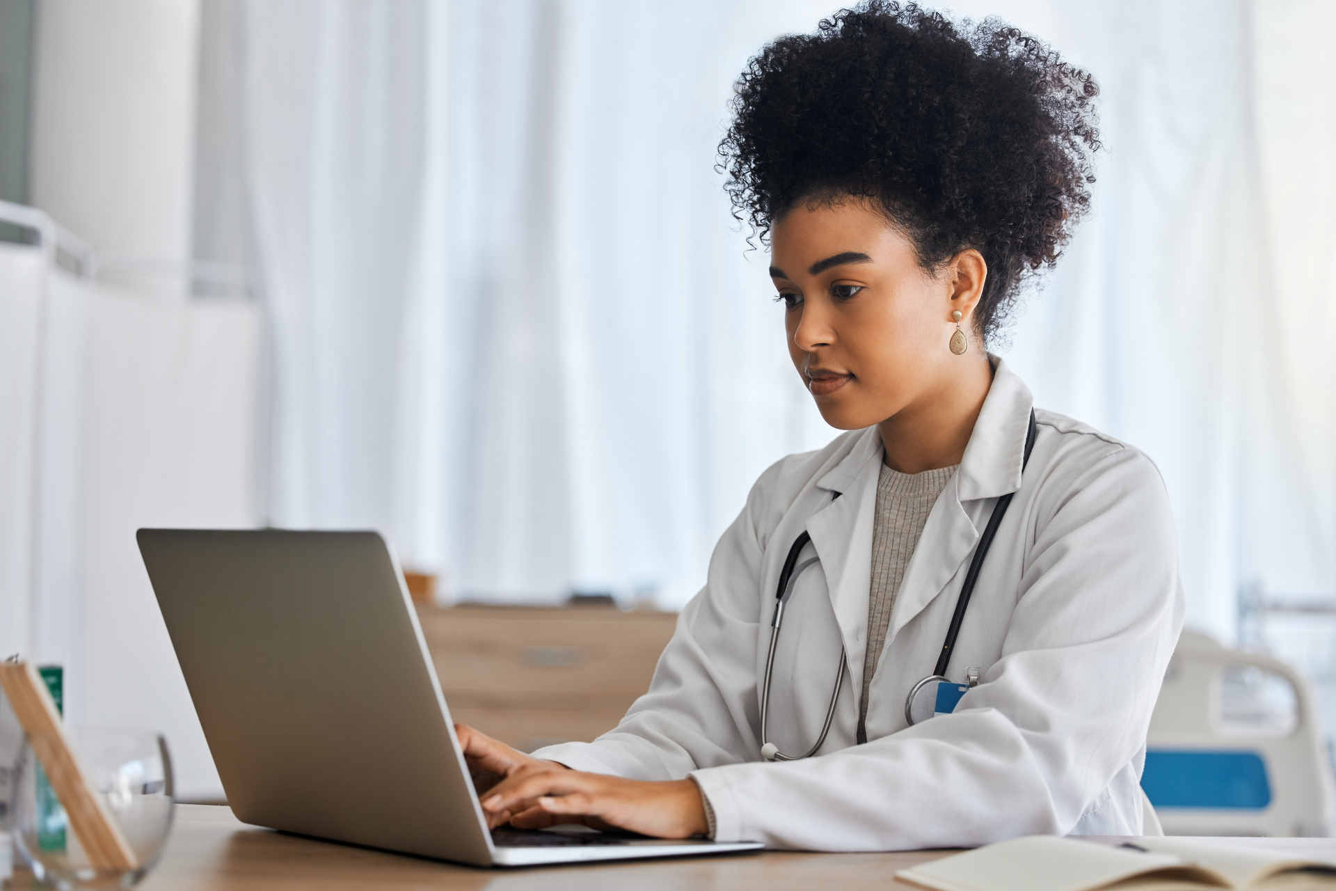 Medical professional using laptop to conduct research