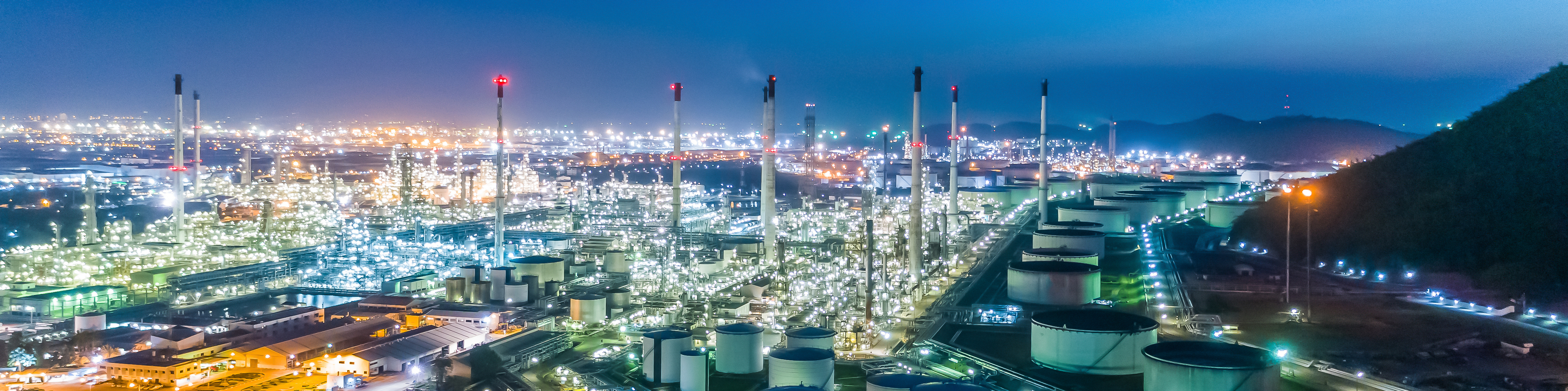 Aerial top view Oil refinery factory at night for energy or gas industry background