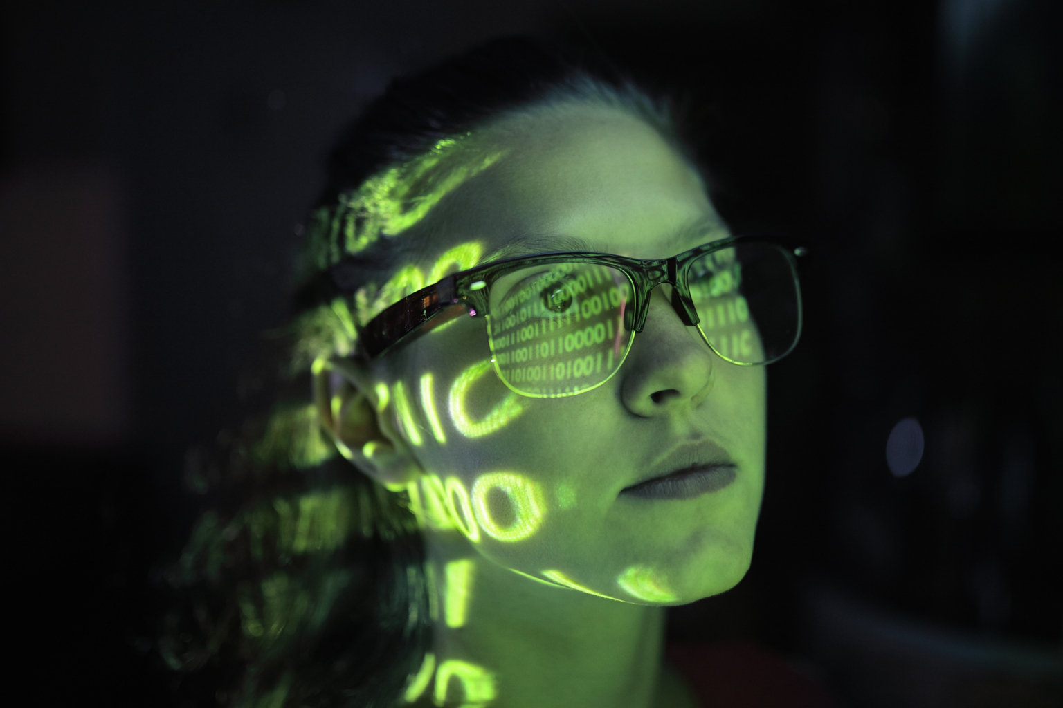 Portrait of girl lighted with green numbers