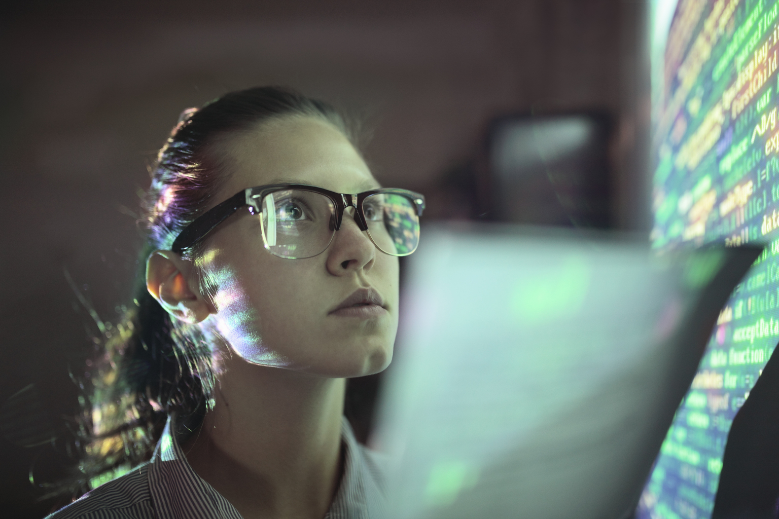 Woman looking at wall with code