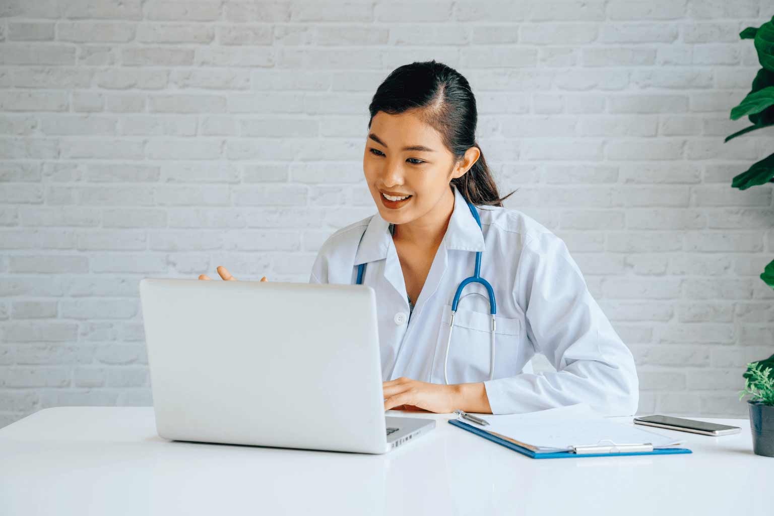 HL-Insights Online-video-conference-chat-with-Asian-female-doctor-and-patient-while-discussing-and-diagnosing-on