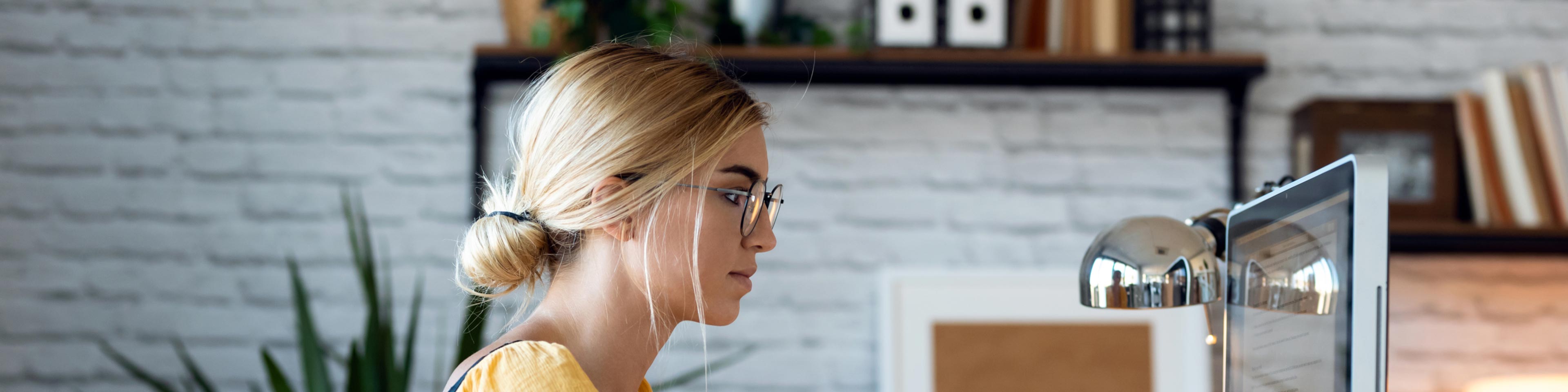 woman at desk reviewing what employers need to know about cobra